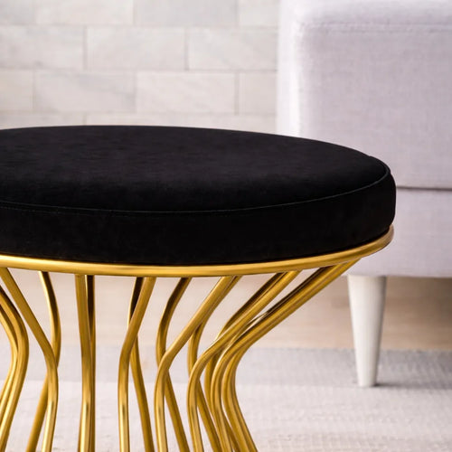 black-velvet-pouffe-with-glamorous-gold-detailing
