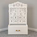 White Wooden Floor Pooja Mandir with Laser-Cut Lotus Om Design, Shubh Labh Motif, Bell Pattern Doors With Cabinet